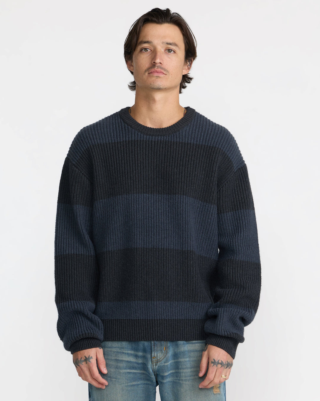 RVCA Men’s Fisherman Sweater in Pirate Black, front view on model