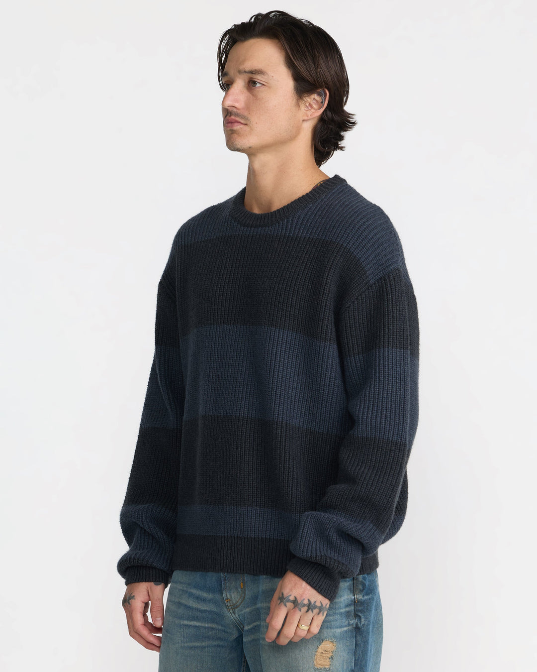 RVCA Men’s Fisherman Sweater in Pirate Black, side view on model