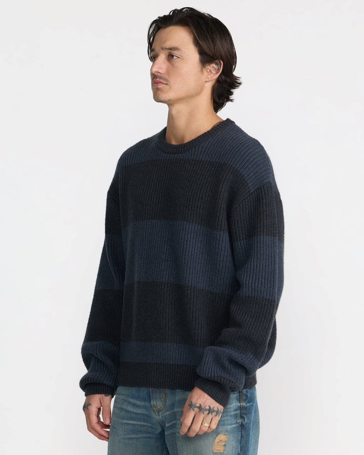 RVCA Men’s Fisherman Sweater in Pirate Black, side view on model