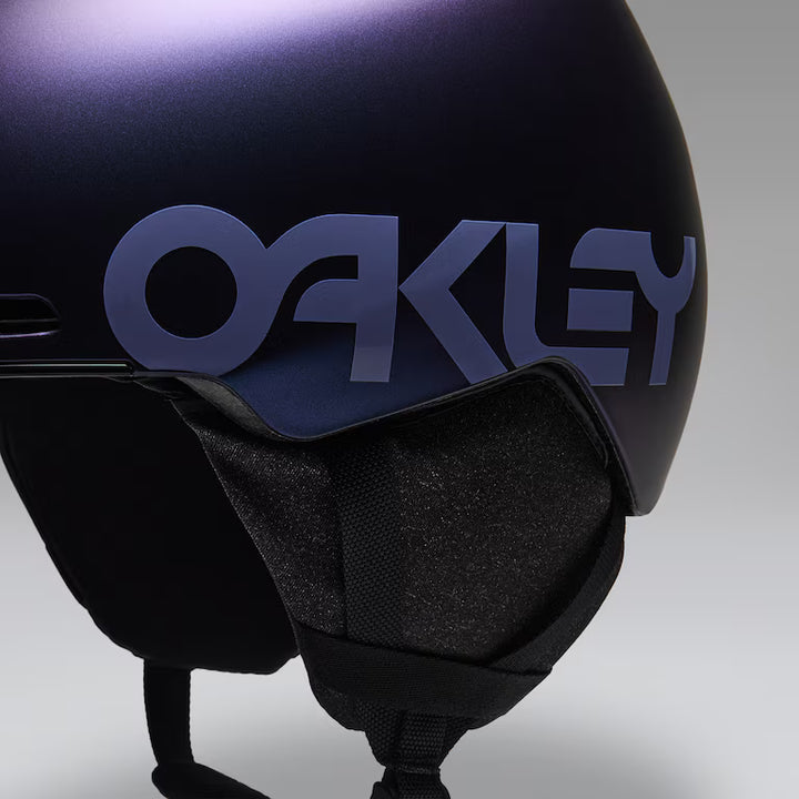 Oakley MOD1 snow helmet in Cyan Blue Colorshift, Oakley logo and ear pad detail 