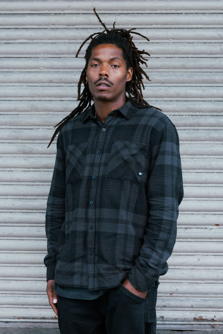 686 Men’s SMARTY Headwall Flannel in Black Plaid - front view on model