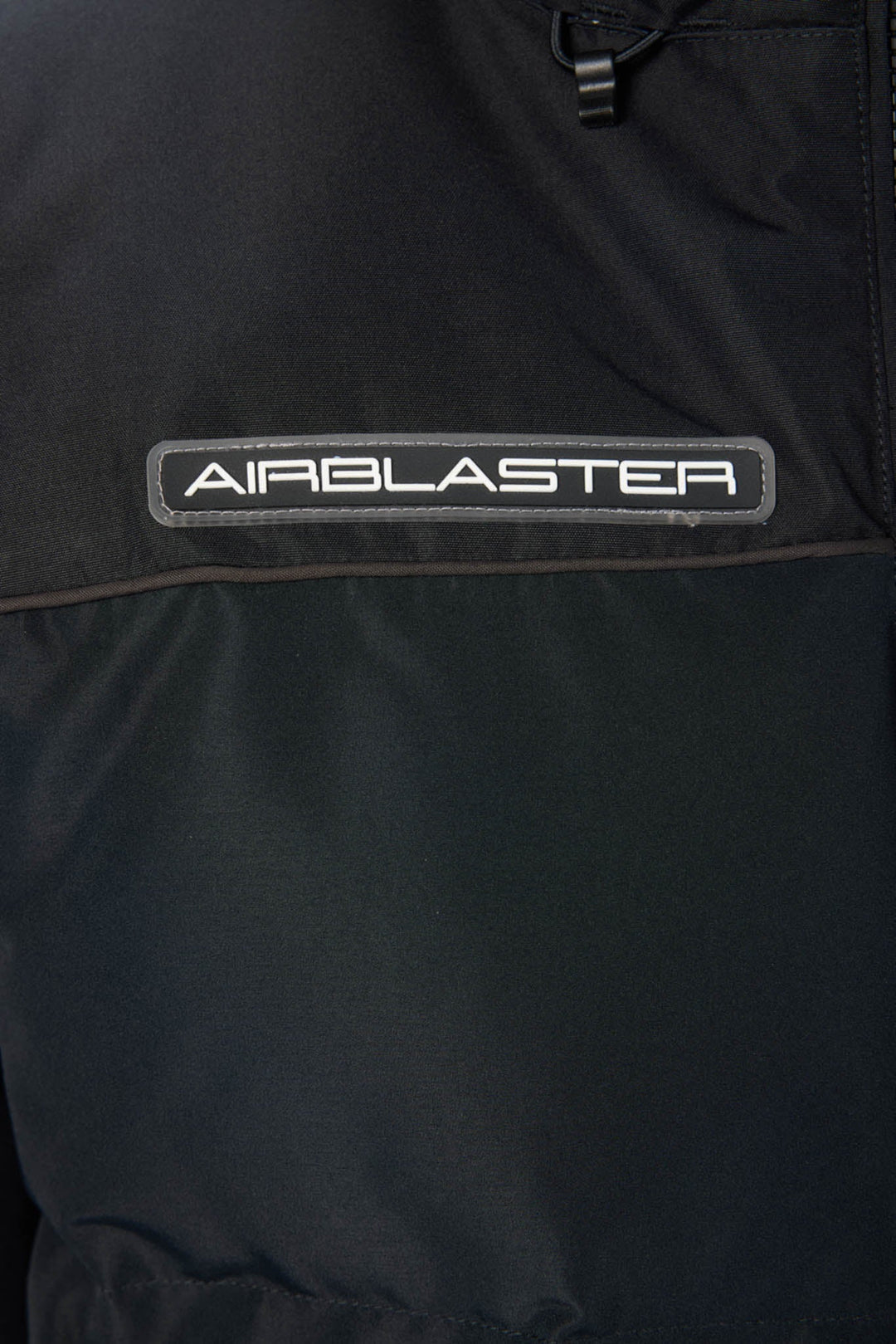 Close-up of a black jacket with &
