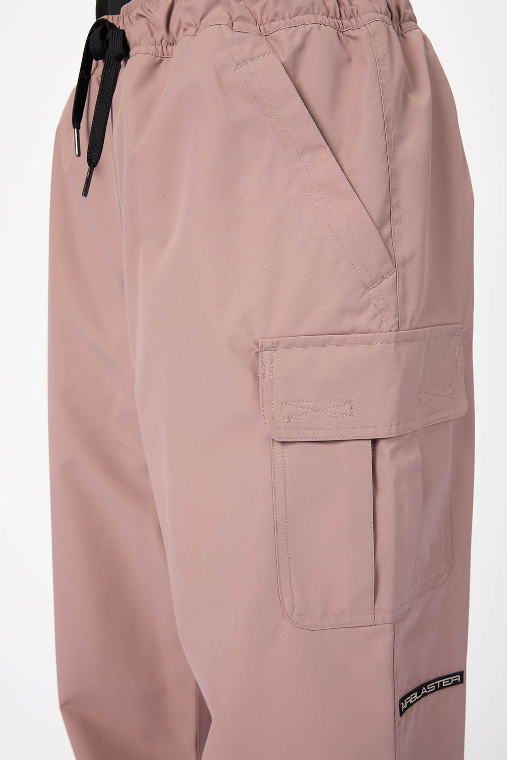 Pink cargo pants with a drawstring on a white background