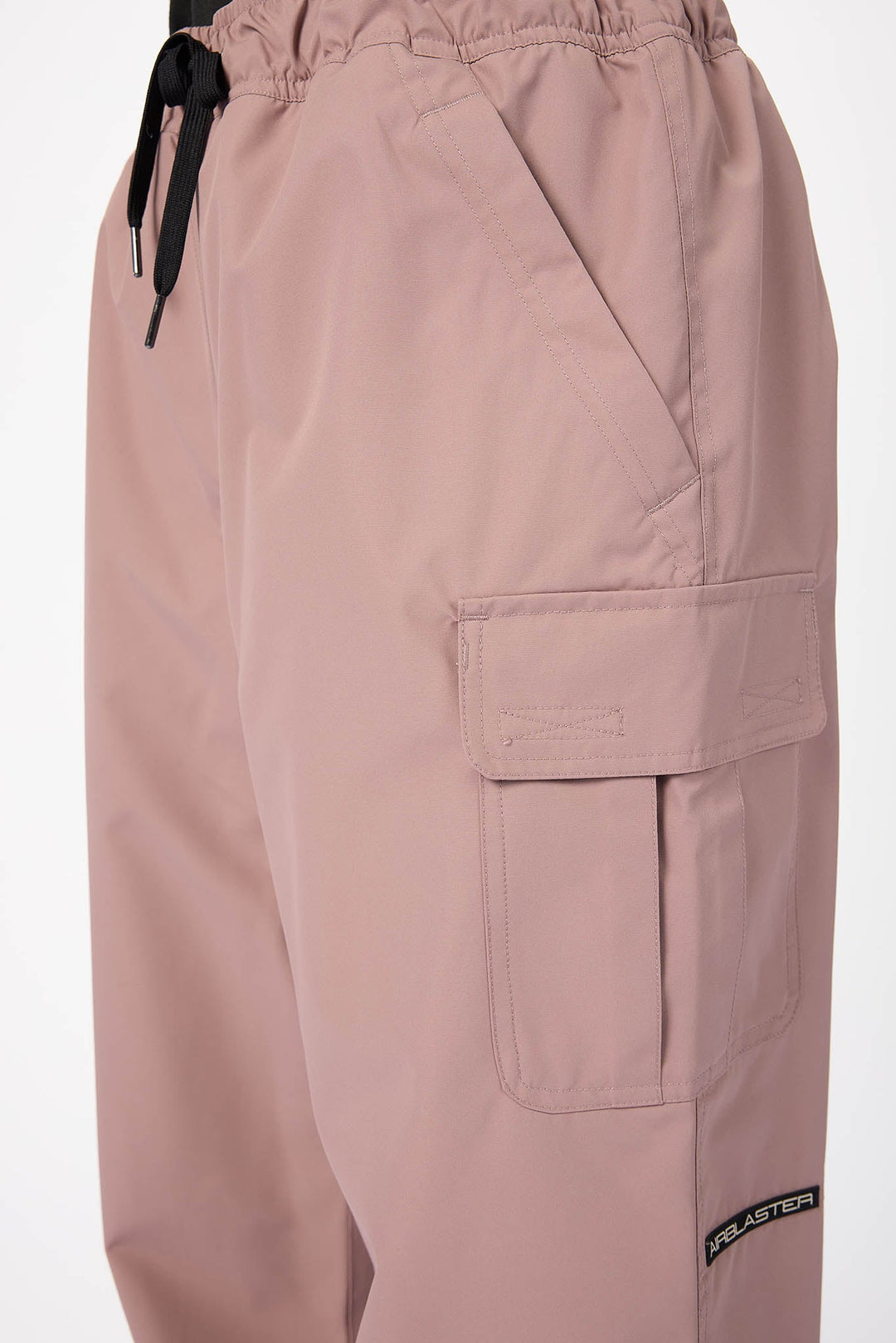 Pink cargo pants with a drawstring on a white background