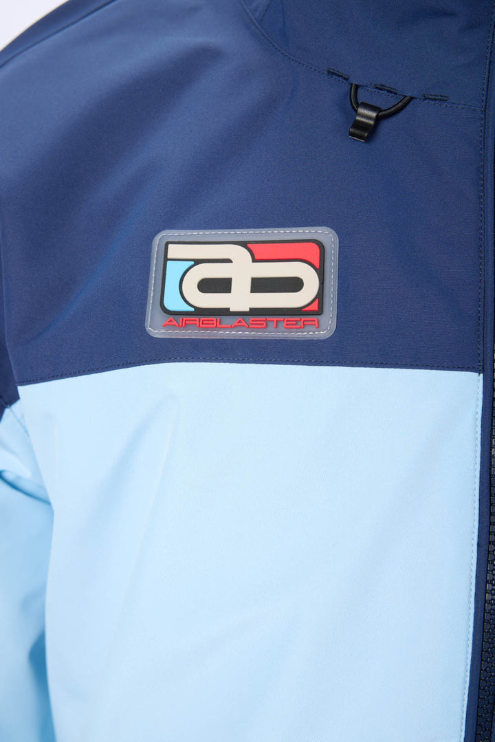Close-up of a blue and light blue jacket with a brand logo on the chest.